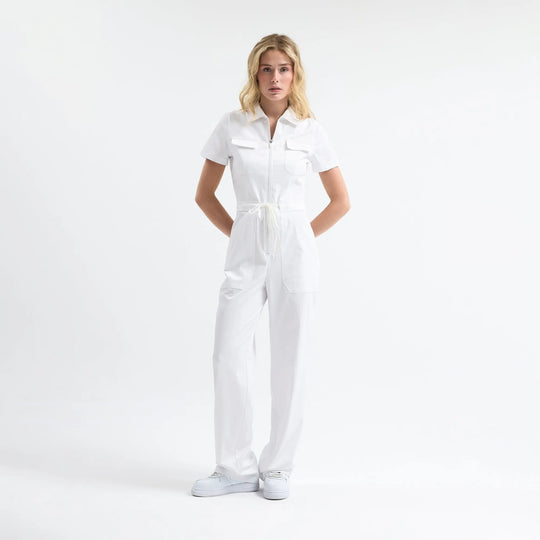 Serene white scrub tulum, front zip, drawstring waist, short sleeves.