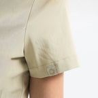 Sunray Slim Scrubs tulum Marl; etek ucunda logo yama ve dikiş detayı.