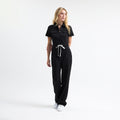 Serene black scrub tulum with short sleeves, chest pockets, and drawstring waist