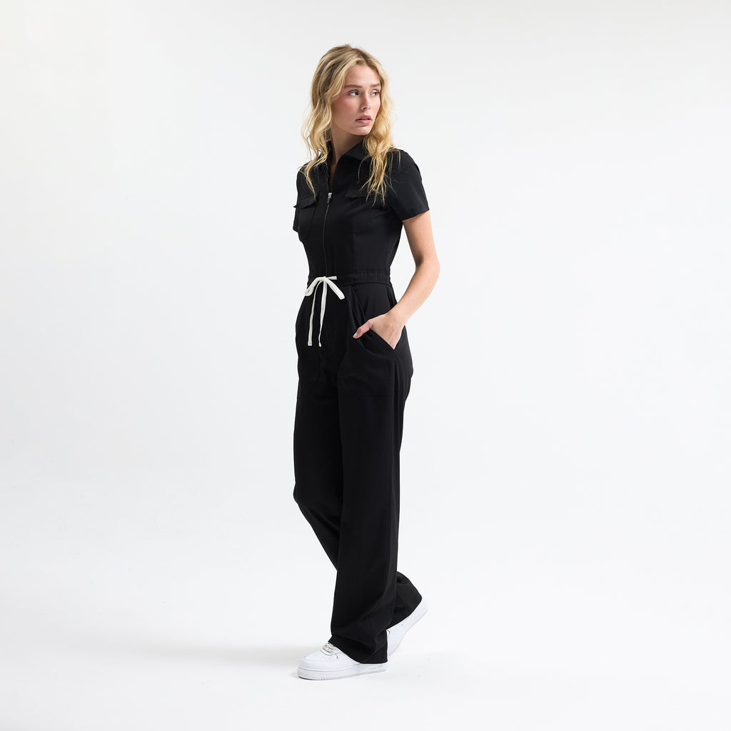 Serene black scrub tulum side view with drawstring waist and wide straight legs