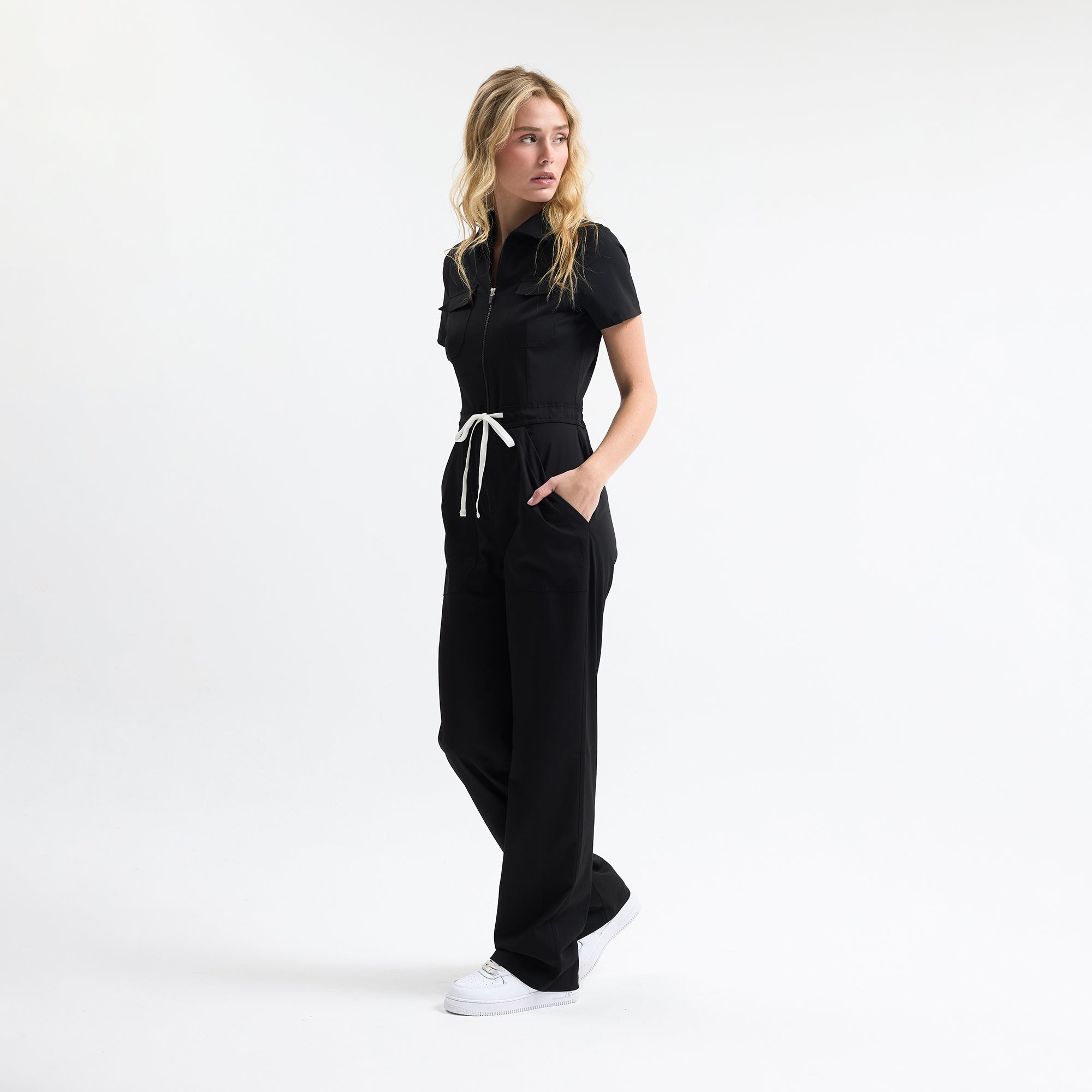 Serene black scrub tulum side view with drawstring waist and wide straight legs