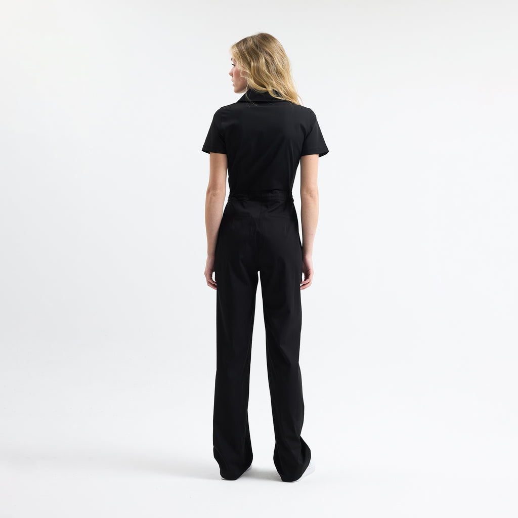 Black scrub tulum back view with wide straight legs