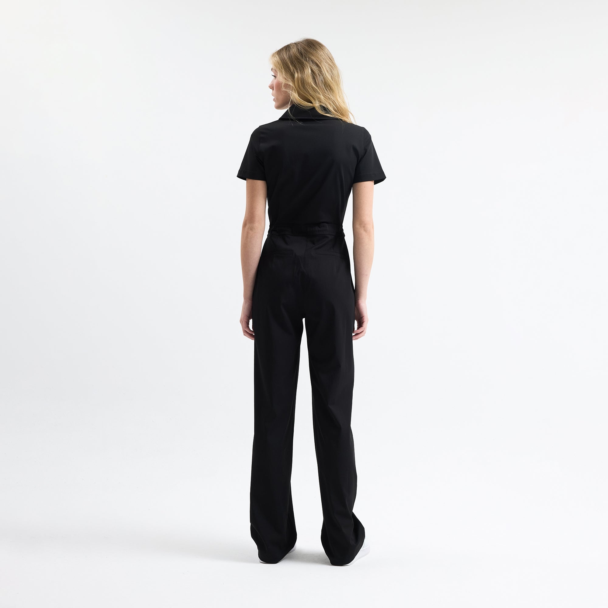 Black scrub tulum back view with wide straight legs