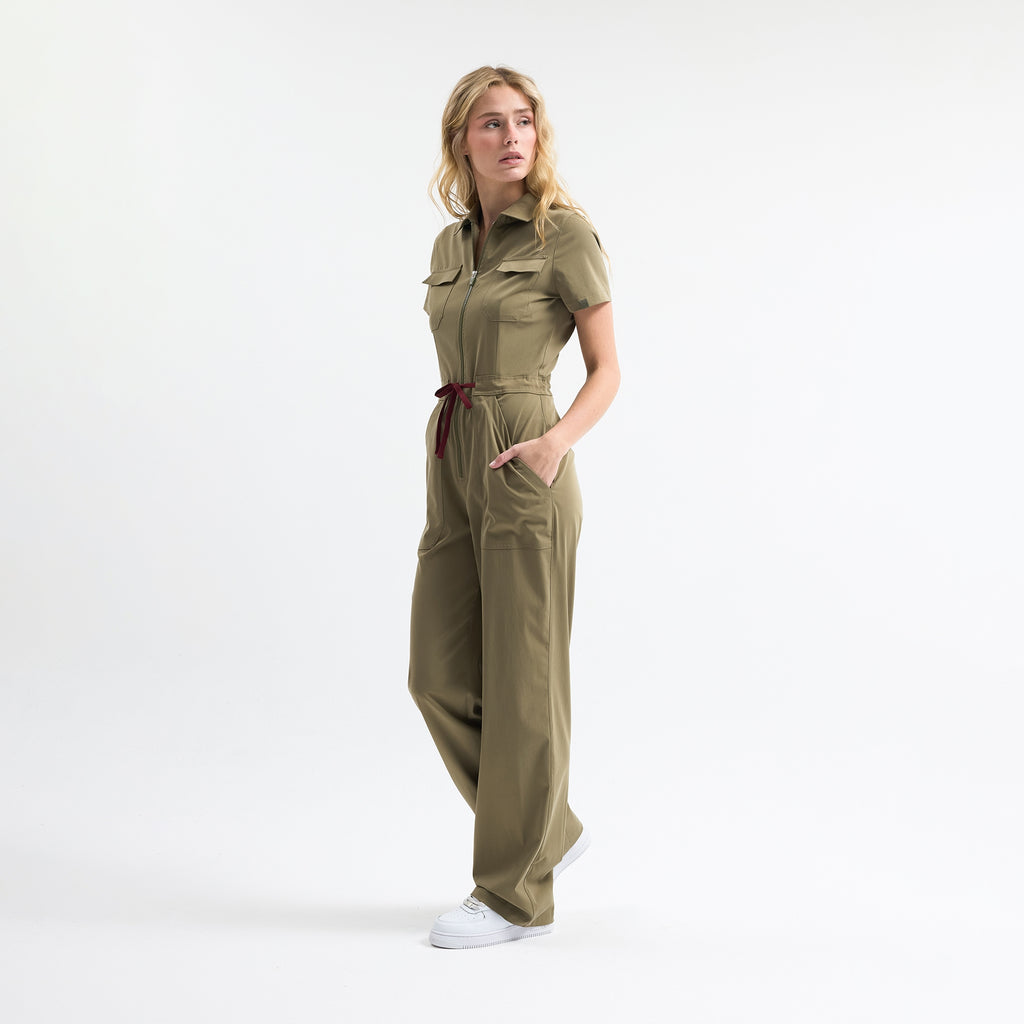 Hunter green scrub tulum, short sleeves, front zip, tie waist, utility pockets