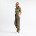 Hunter green scrub tulum, short sleeves, front zip, tie waist, utility pockets