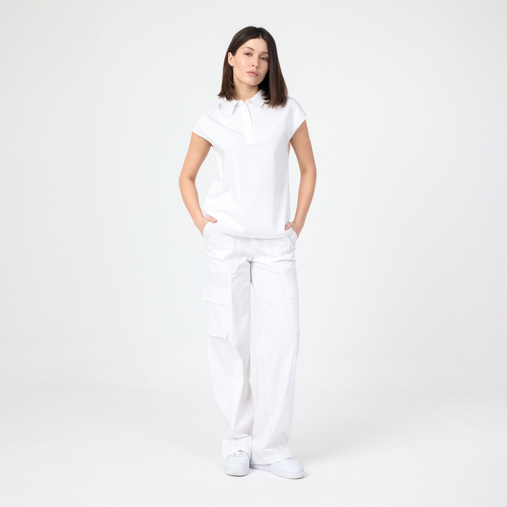White polo T-shirt on model, short sleeves, button placket and collar