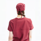 Maroon scrub top, back view with center seam and short sleeves