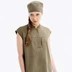 Hunter green scrub top with front zip and chest pockets