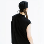 Black scrub top back view with high collar and scrub cap tie detail