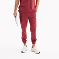 Chili renkli jogger scrub pantolon; yan cepler ve ayarlanabilir pa lastiği